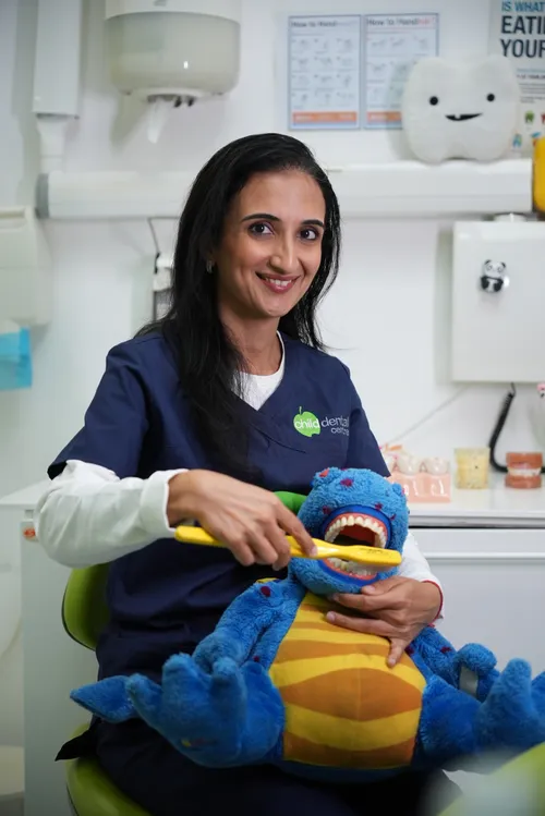 Dr. Radhika Toprani — with Dino